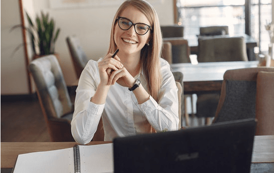 woman at desk with computer in office
